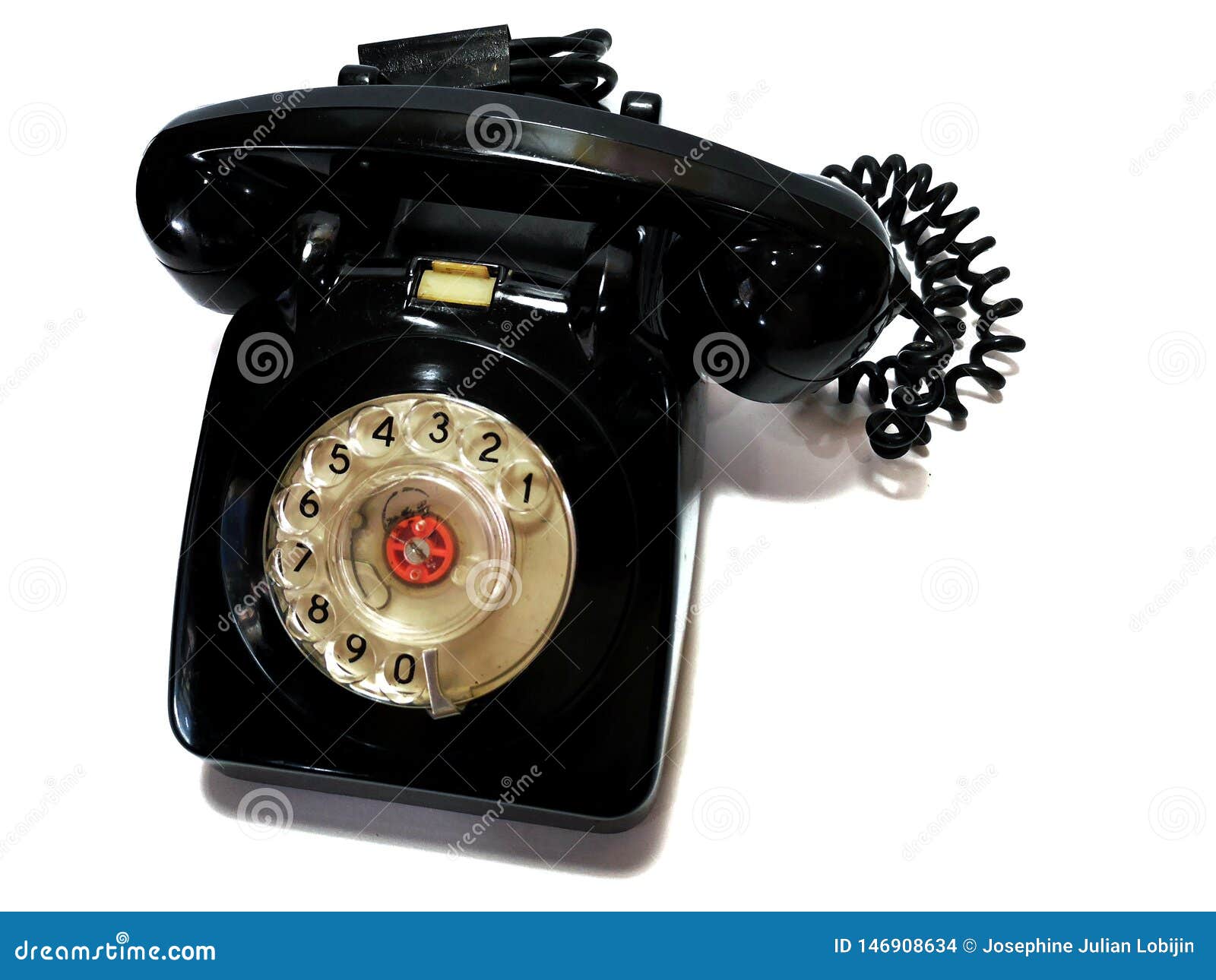 a vintage and antique telephone with white background.